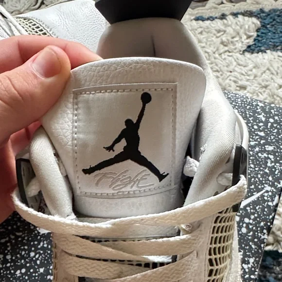 Air Jordan 4 Retro White and Black Sneakers